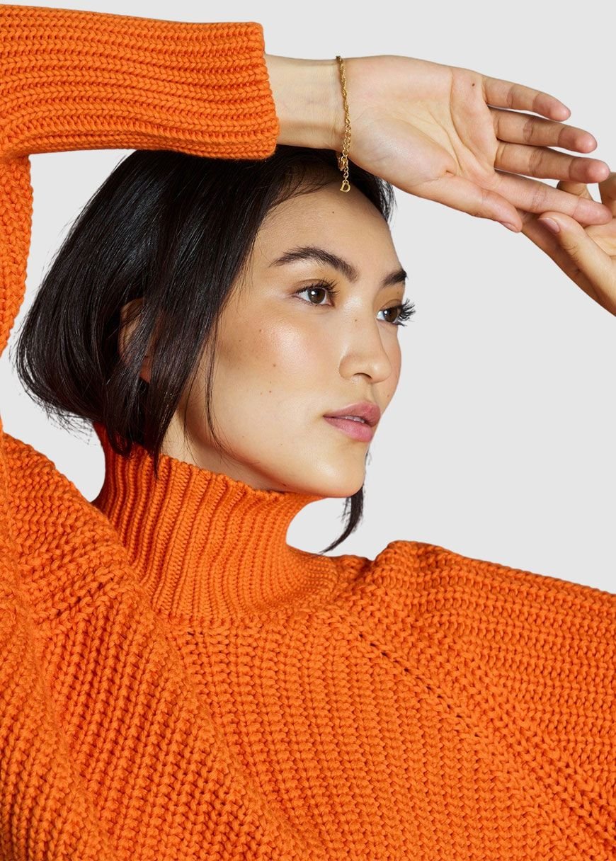 bright orange turtleneck